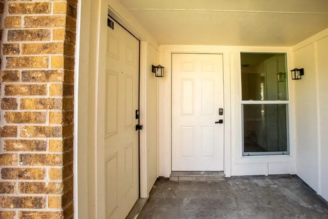 a view of a bathroom with a shower and a sink