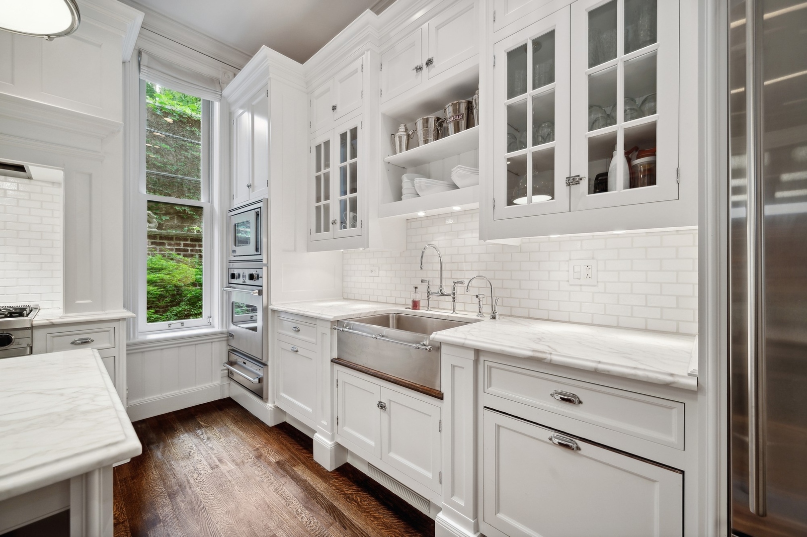 39 East Elm Street Chicago, IL 60611 - Photo 12 of 49 a kitchen with a sink window and cabinets