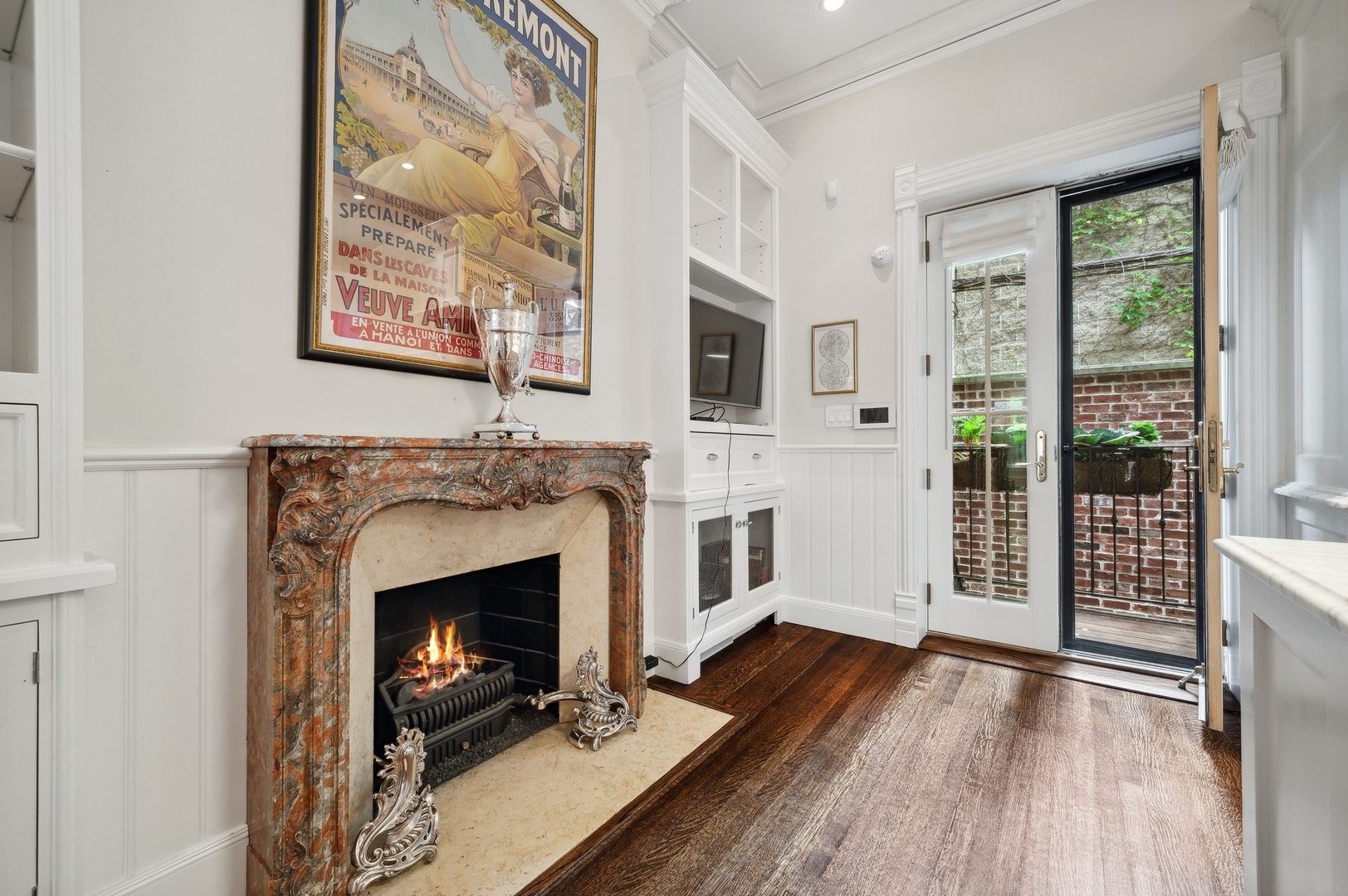39 East Elm Street Chicago, IL 60611 - Photo 14 of 49 a living room with a fireplace and a floor to ceiling window