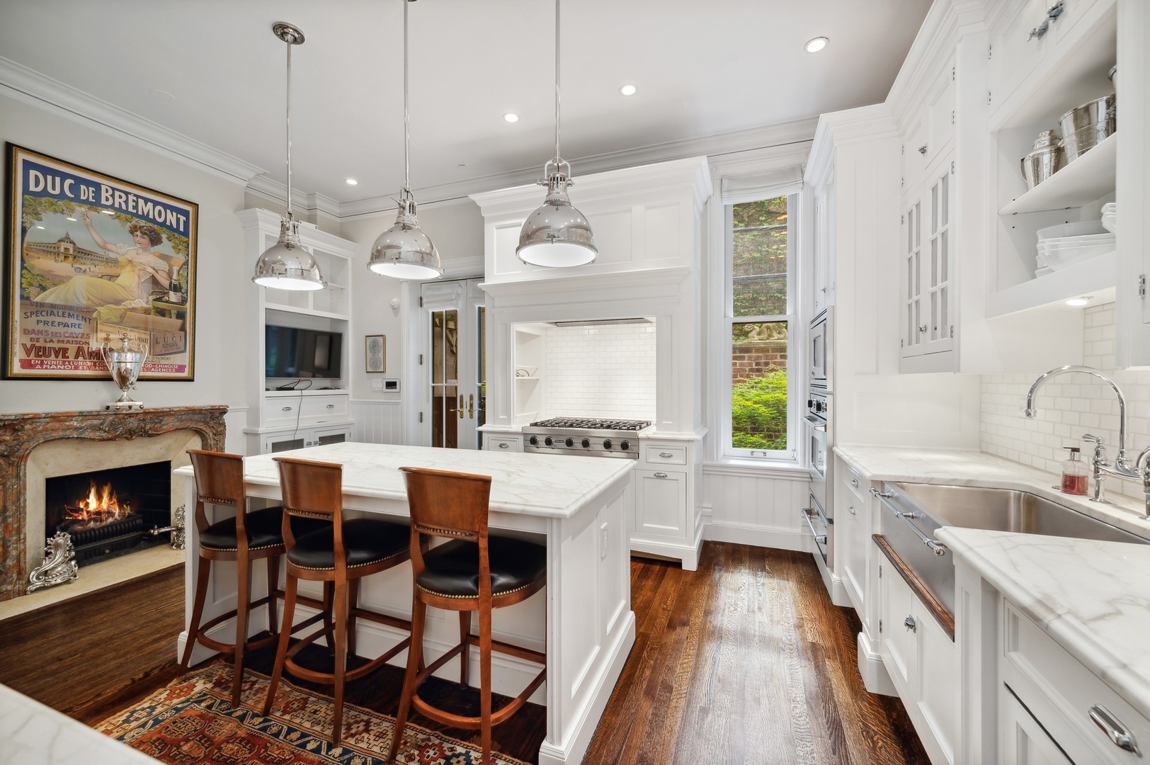 39 East Elm Street Chicago, IL 60611 - Photo 21 of 49 a large kitchen with a table and chairs