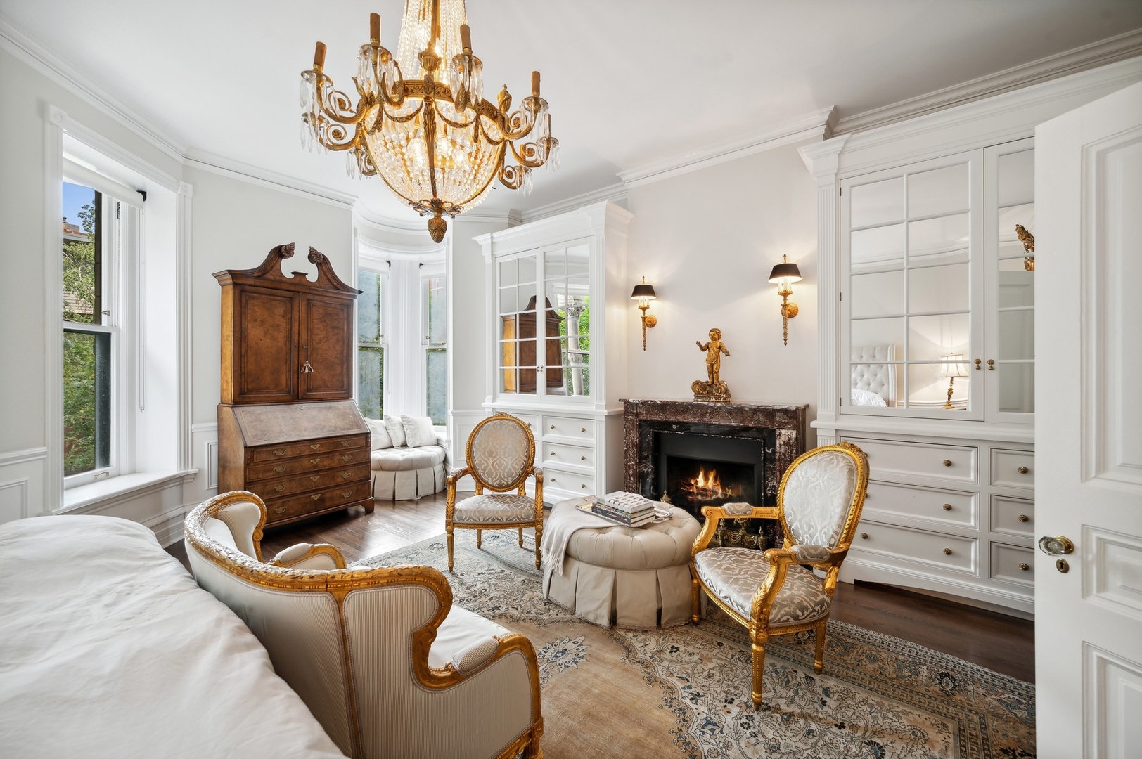 39 East Elm Street Chicago, IL 60611 - Photo 23 of 49 a living room with furniture a fireplace and a chandelier
