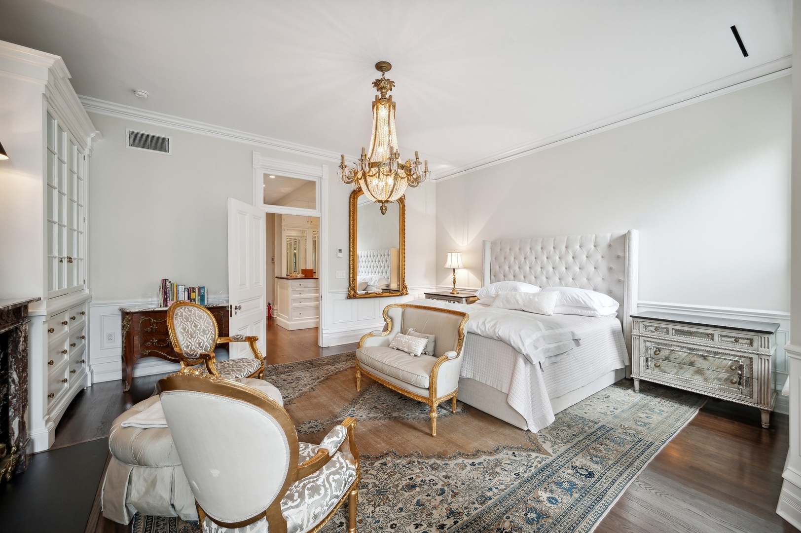 39 East Elm Street Chicago, IL 60611 - Photo 26 of 49 a bed room with furniture and a chandelier
