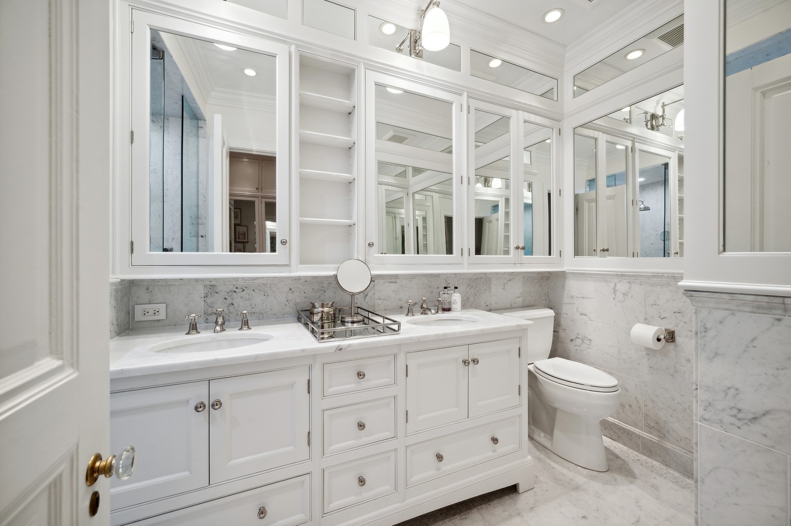 39 East Elm Street Chicago, IL 60611 - Photo 29 of 49 a bathroom with a double vanity sink mirror and toilet