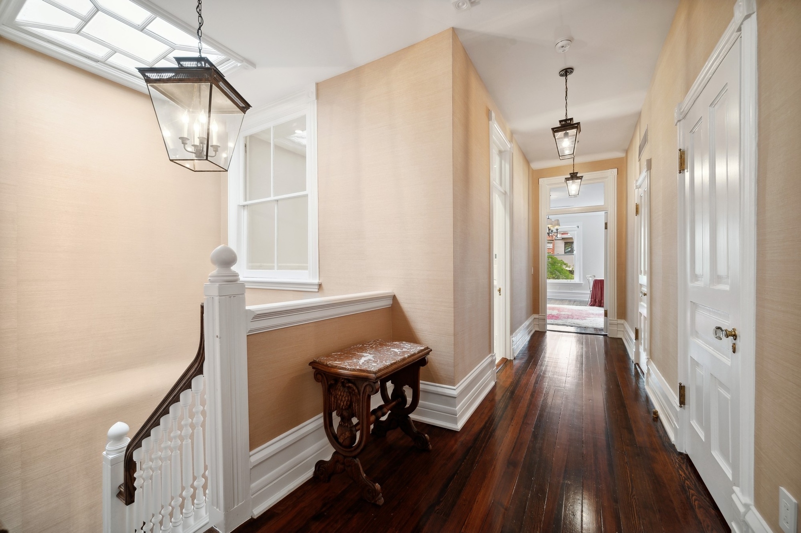 39 East Elm Street Chicago, IL 60611 - Photo 33 of 49 a view of a hallway with wooden floor and staircase