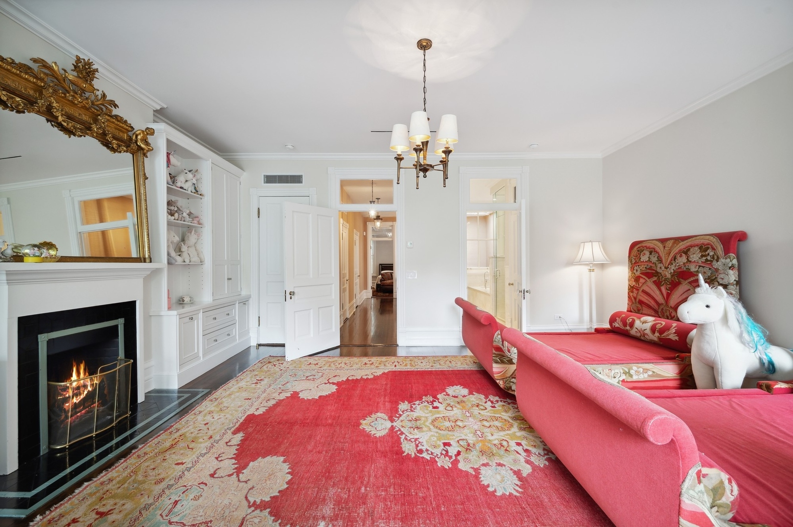 39 East Elm Street Chicago, IL 60611 - Photo 35 of 49 a bedroom with a bed and a fireplace