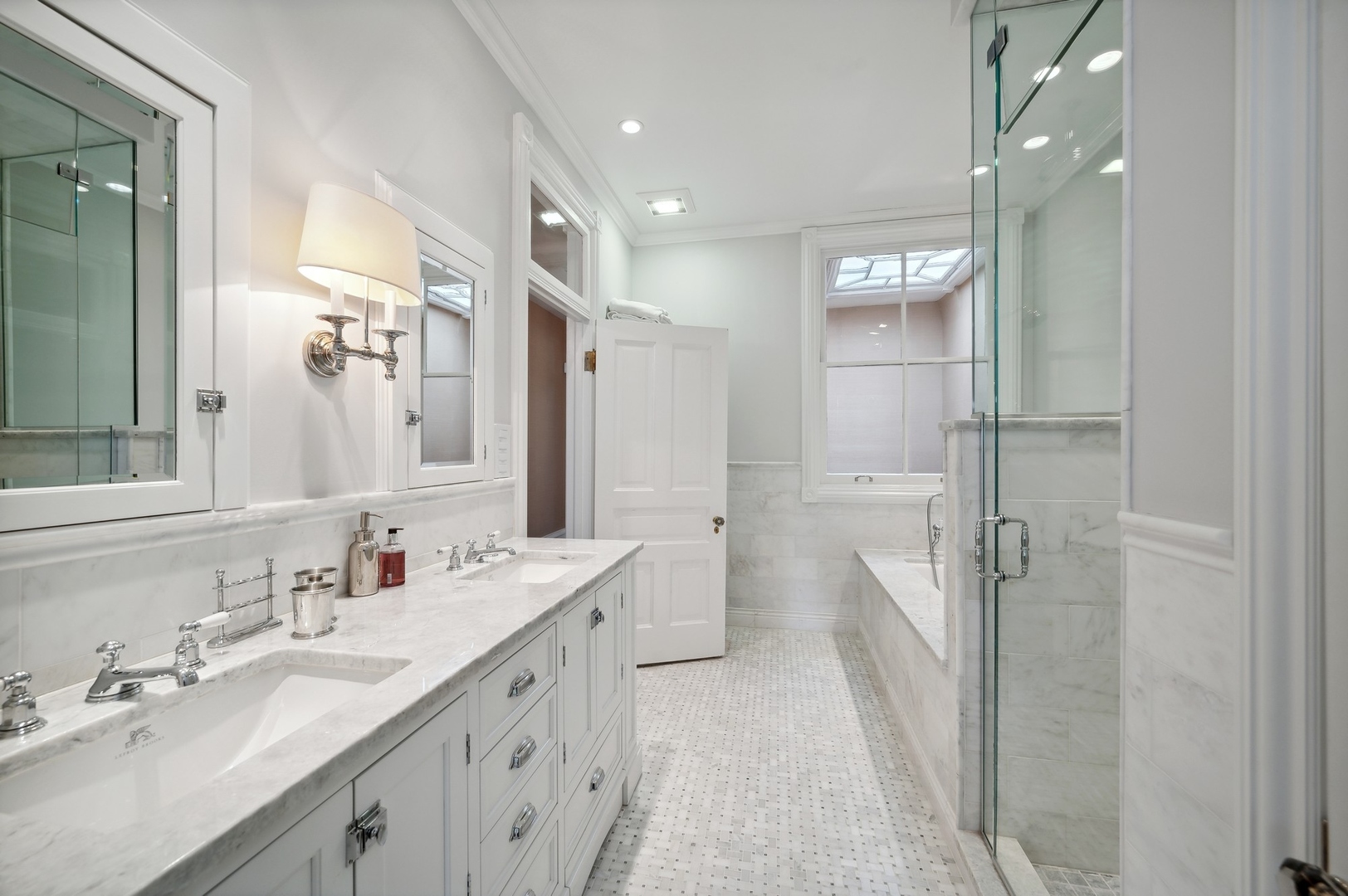 39 East Elm Street Chicago, IL 60611 - Photo 36 of 49 a bathroom with a double vanity sink mirror double and shower