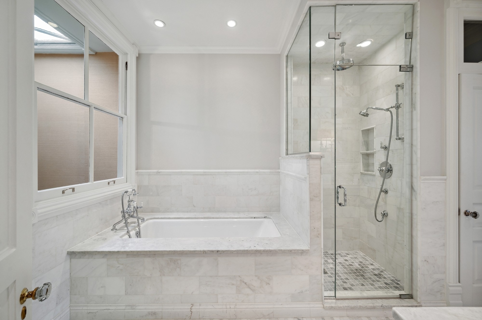 39 East Elm Street Chicago, IL 60611 - Photo 37 of 49 a bathroom with a bathtub and a shower