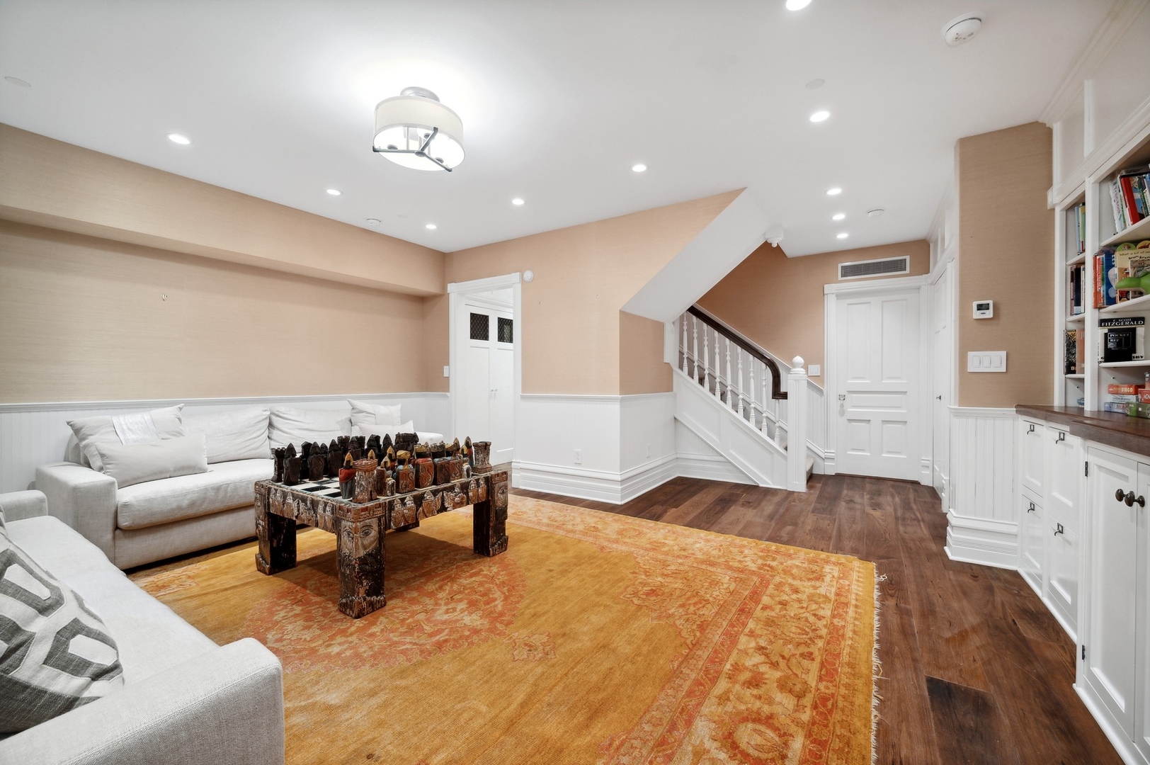 39 East Elm Street Chicago, IL 60611 - Photo 41 of 49 a living room with furniture and a wooden floor