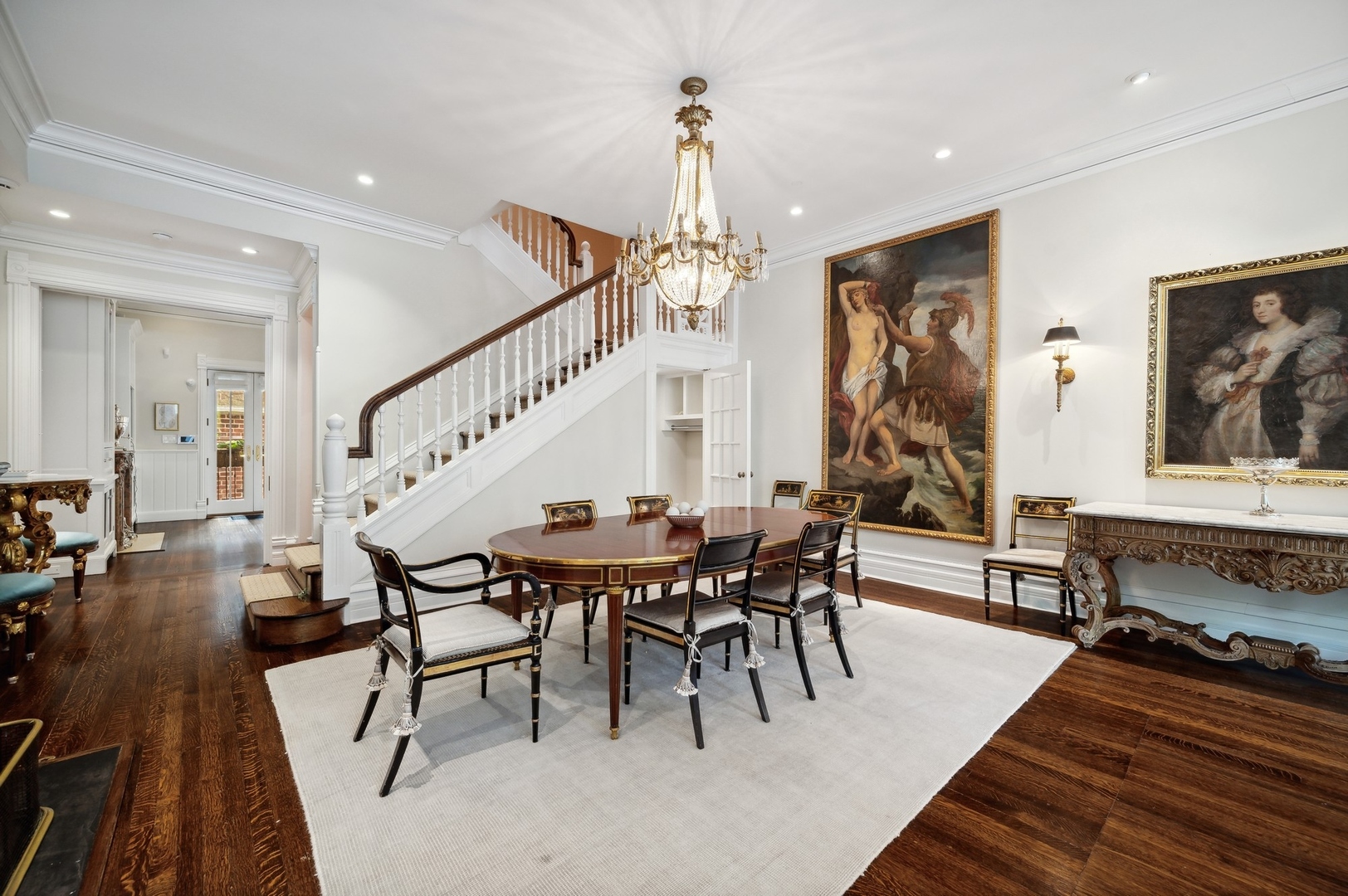 39 East Elm Street Chicago, IL 60611 - Photo 9 of 49 a dining room with wooden floor a chandelier a wooden table and chairs