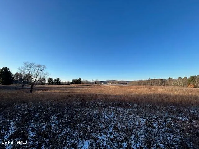 a view of a lake with mountains in the background
