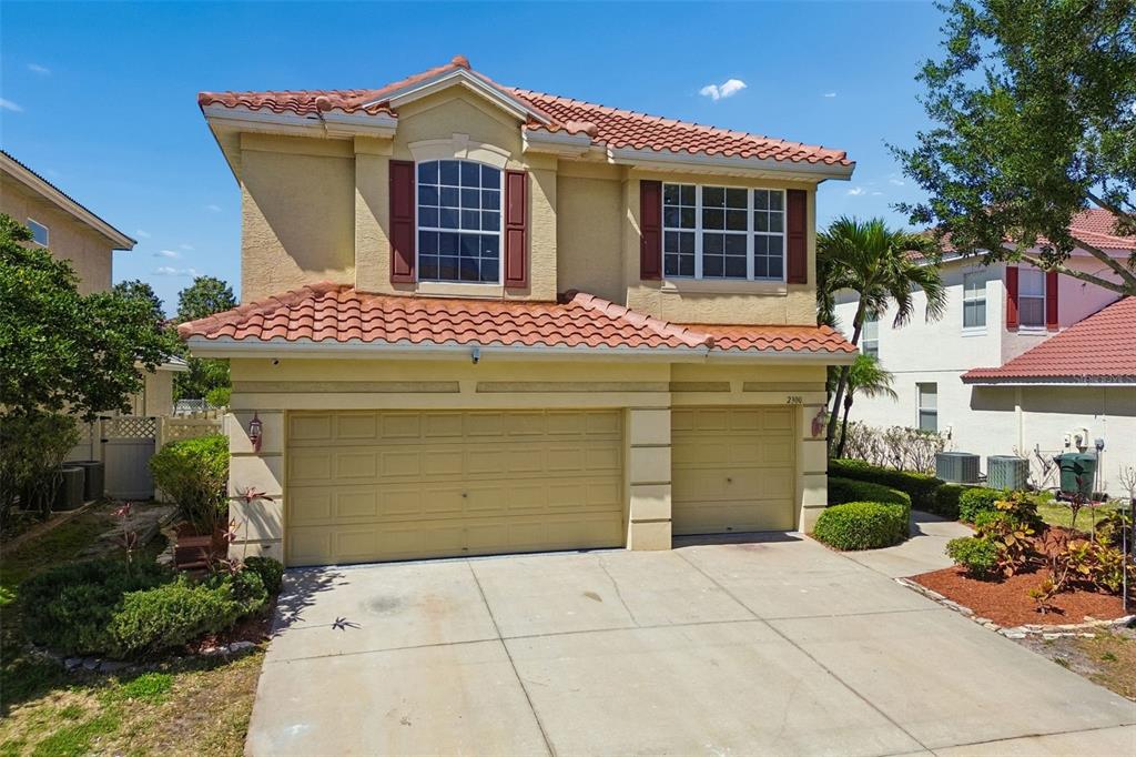2300 Hannah Way South Dunedin, FL 34698 - Photo 1 of 49 a view of a house with large windows and plants