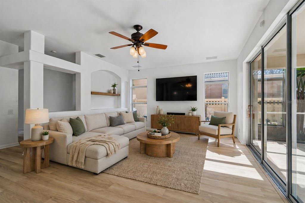 2300 Hannah Way South Dunedin, FL 34698 - Photo 12 of 49 a living room with furniture a flat screen tv and a large window