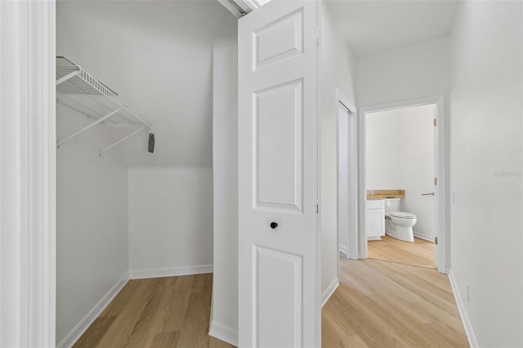 2300 Hannah Way South Dunedin, FL 34698 - Photo 17 of 49 a view of a room with wooden floor and bathroom view