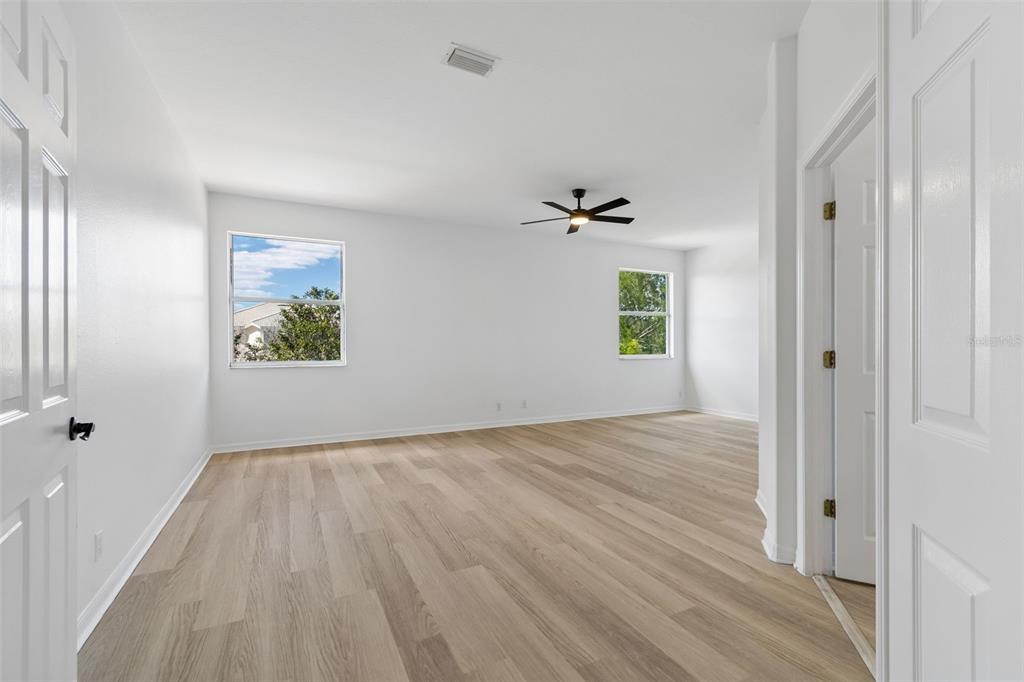 2300 Hannah Way South Dunedin, FL 34698 - Photo 22 of 49 wooden floor in an empty room with a window
