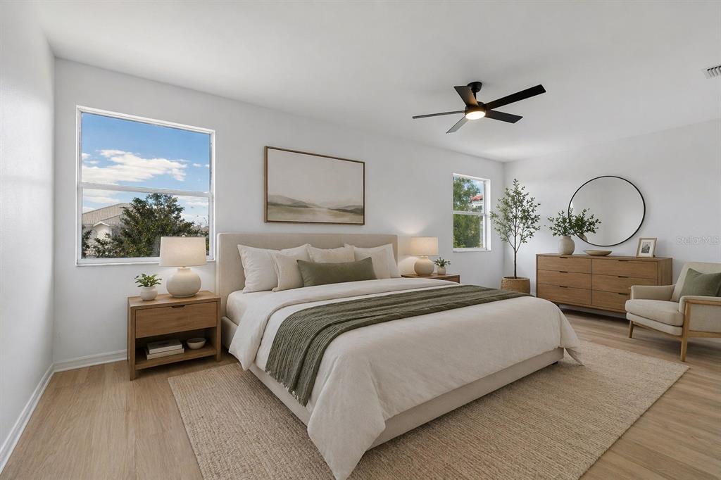 2300 Hannah Way South Dunedin, FL 34698 - Photo 23 of 49 a bedroom with bed and a painting on the wall