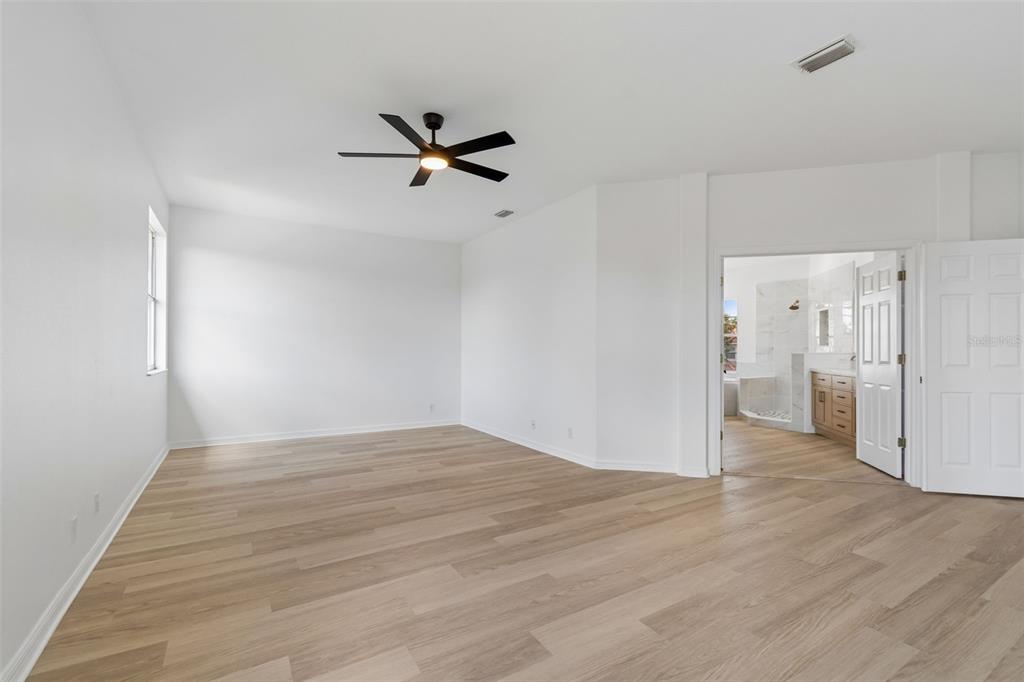 2300 Hannah Way South Dunedin, FL 34698 - Photo 25 of 49 a view of empty room with wooden floor