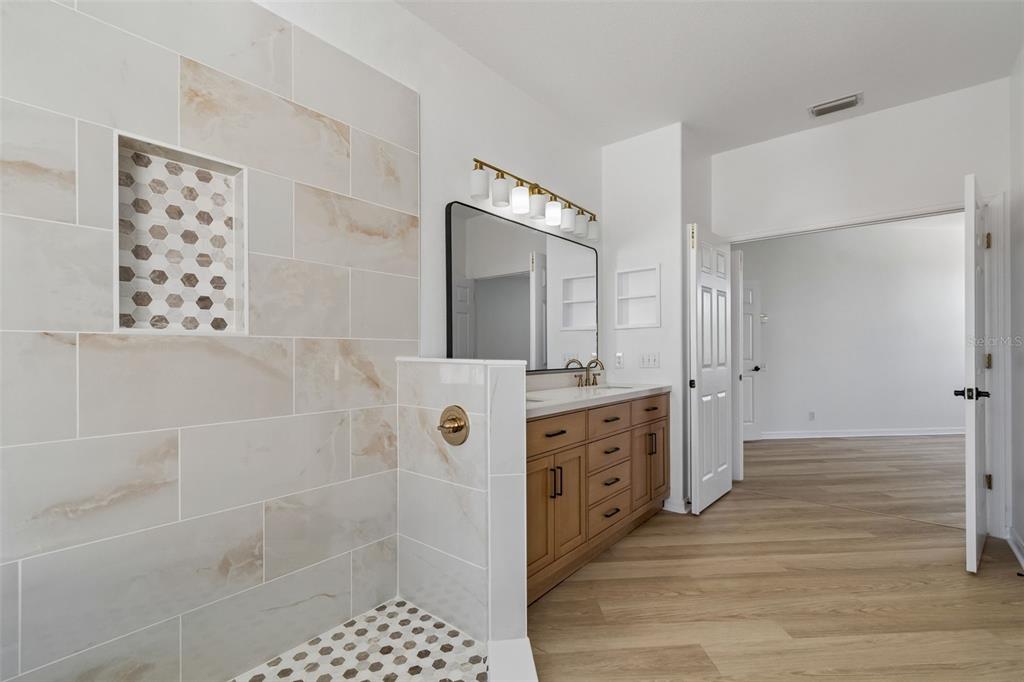 2300 Hannah Way South Dunedin, FL 34698 - Photo 27 of 49 a bathroom with a mirror and a shower