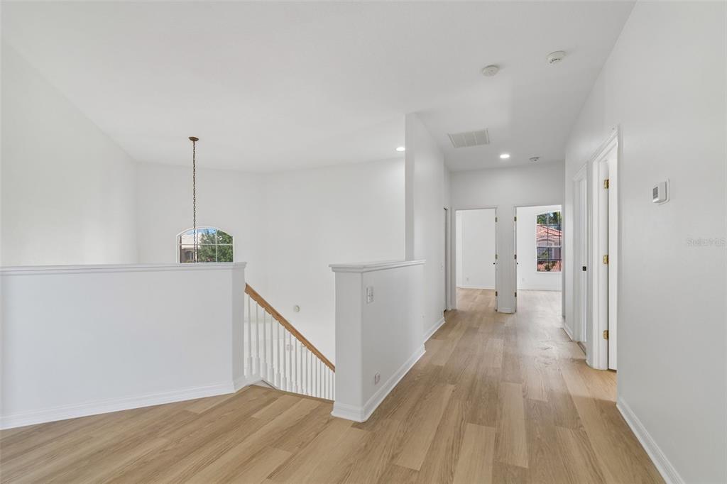 2300 Hannah Way South Dunedin, FL 34698 - Photo 28 of 49 a view of a hallway with wooden floor