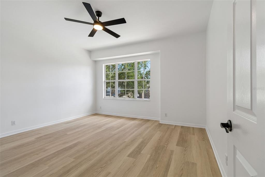 2300 Hannah Way South Dunedin, FL 34698 - Photo 29 of 49 wooden floor in an empty room with a window