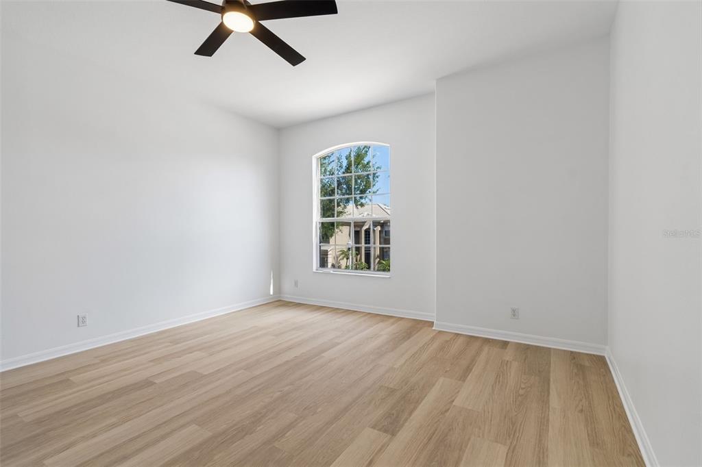 2300 Hannah Way South Dunedin, FL 34698 - Photo 30 of 49 wooden floor in an empty room with a window