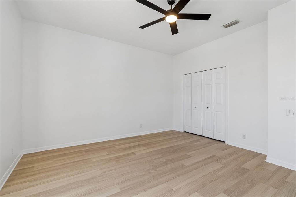 2300 Hannah Way South Dunedin, FL 34698 - Photo 32 of 49 a view of an empty room with wooden floor