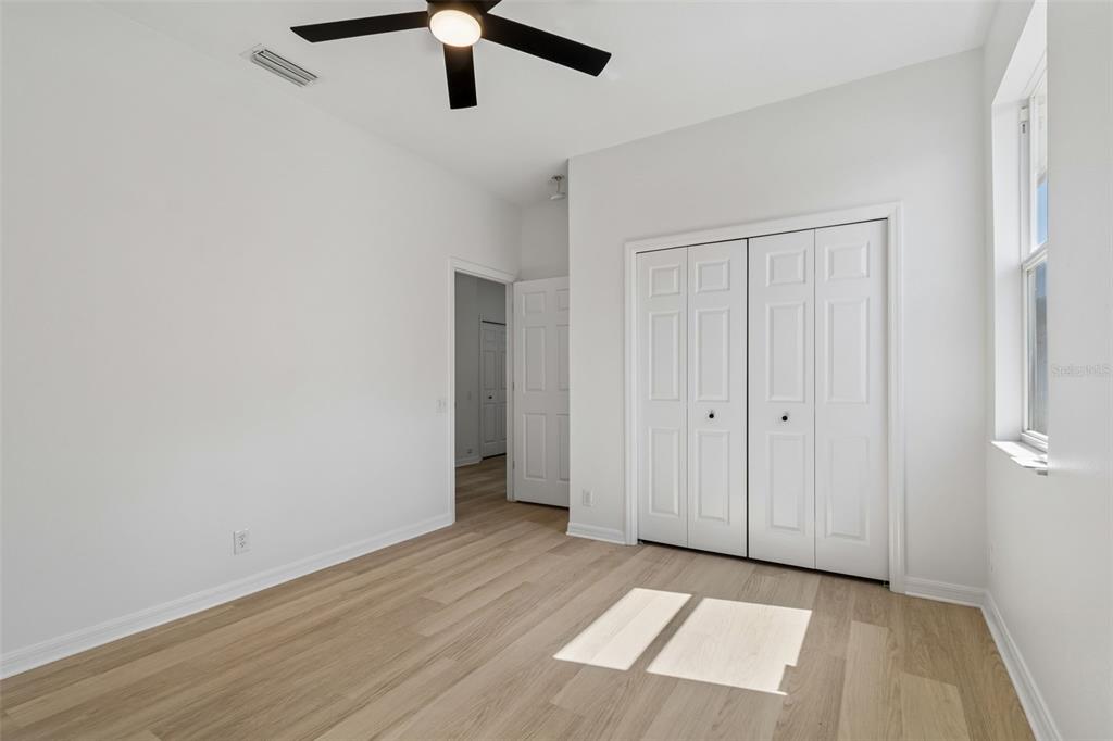 2300 Hannah Way South Dunedin, FL 34698 - Photo 34 of 49 wooden floor in an empty room with a window