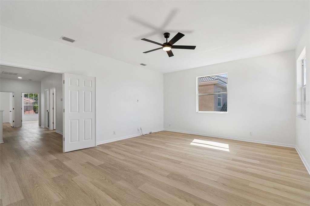 2300 Hannah Way South Dunedin, FL 34698 - Photo 36 of 49 a view of an empty room with wooden floor