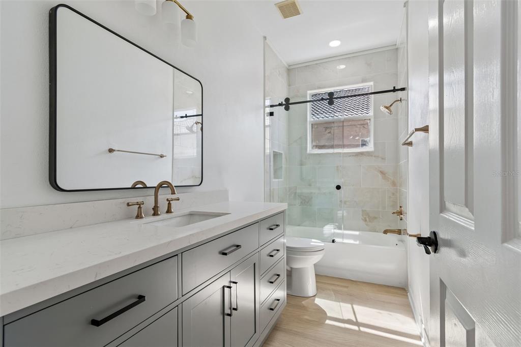 2300 Hannah Way South Dunedin, FL 34698 - Photo 38 of 49 a bathroom with a double vanity sink mirror and double