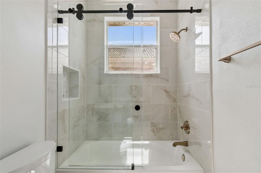 2300 Hannah Way South Dunedin, FL 34698 - Photo 39 of 49 a bathroom with a shower and a bath tub