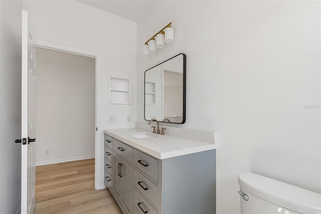 2300 Hannah Way South Dunedin, FL 34698 - Photo 40 of 49 a bathroom with a sink vanity and a mirror
