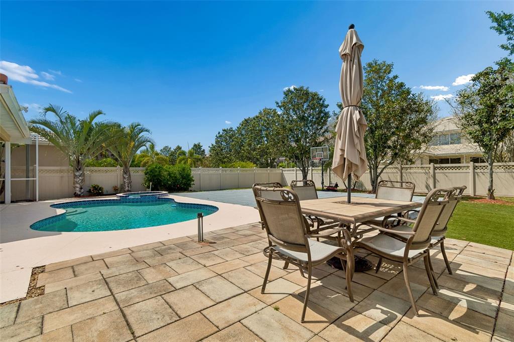 2300 Hannah Way South Dunedin, FL 34698 - Photo 47 of 49 a view of a patio with table and chairs and potted plants