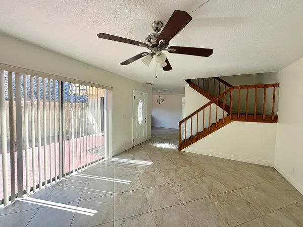 a view of entryway and hall with a chandelier