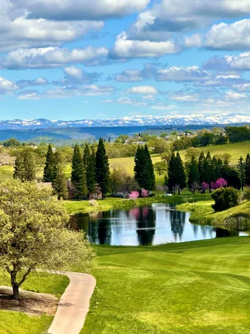 a view of a lake with a yard