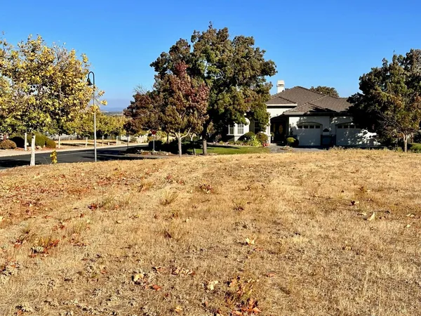 a pathway of a house with a yard