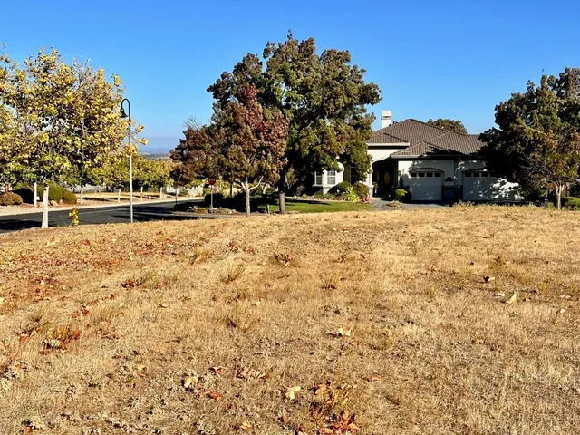 a pathway of a house with a yard