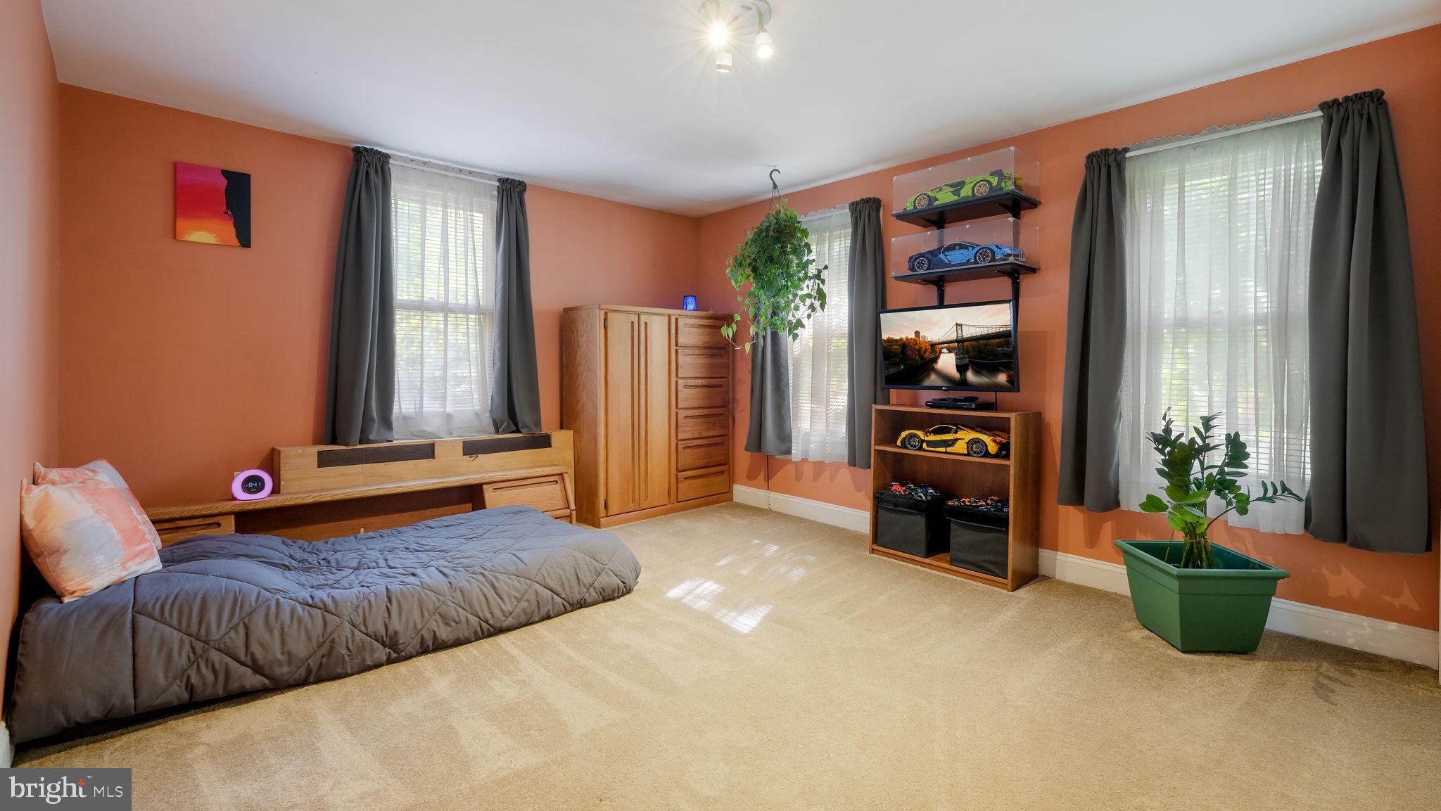 500 Prospect Road Warminster, PA 18974 - Photo 17 of 28 a bedroom with furniture and book shelf