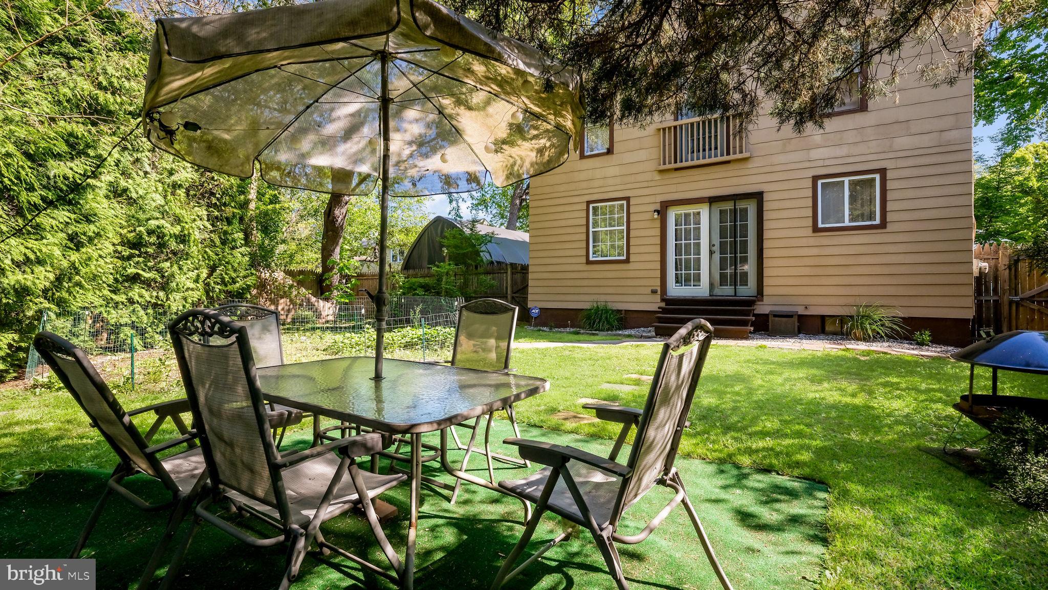 500 Prospect Road Warminster, PA 18974 - Photo 22 of 28 a backyard of a house with table and chairs