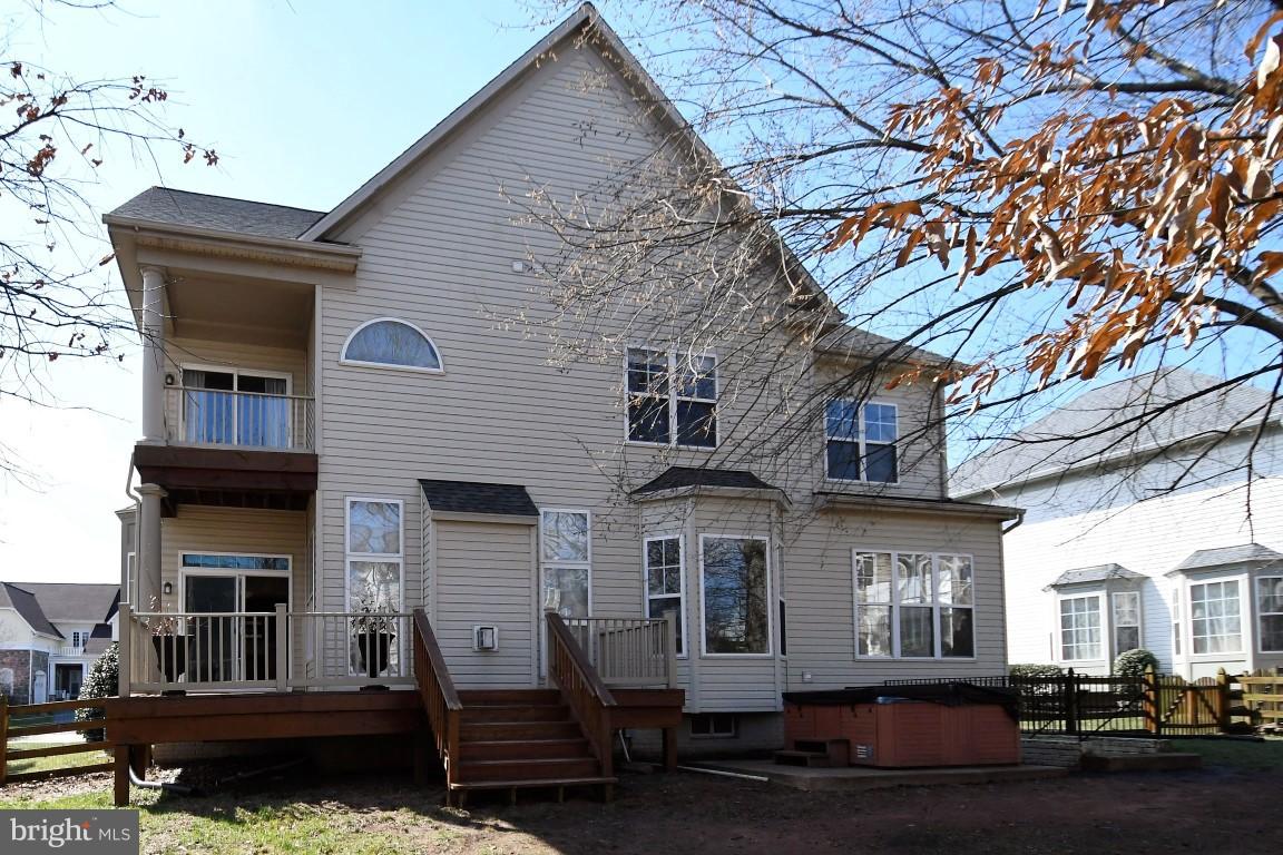 12845 Victory Lakes Loop Bristow, VA 20136 - Photo 2 of 27 a front view of a house with yard and parking