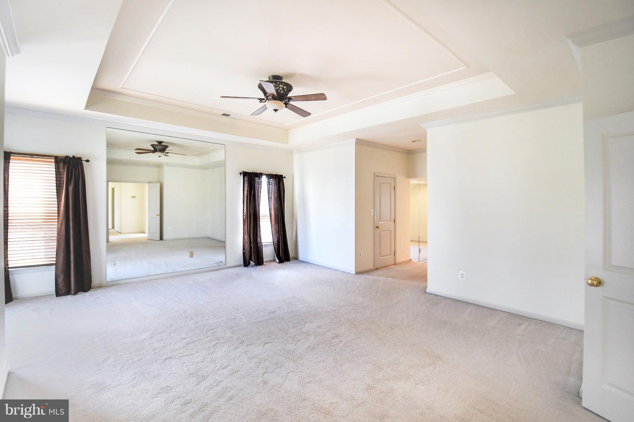 12845 Victory Lakes Loop Bristow, VA 20136 - Photo 12 of 27 a view of a big room with closet and windows