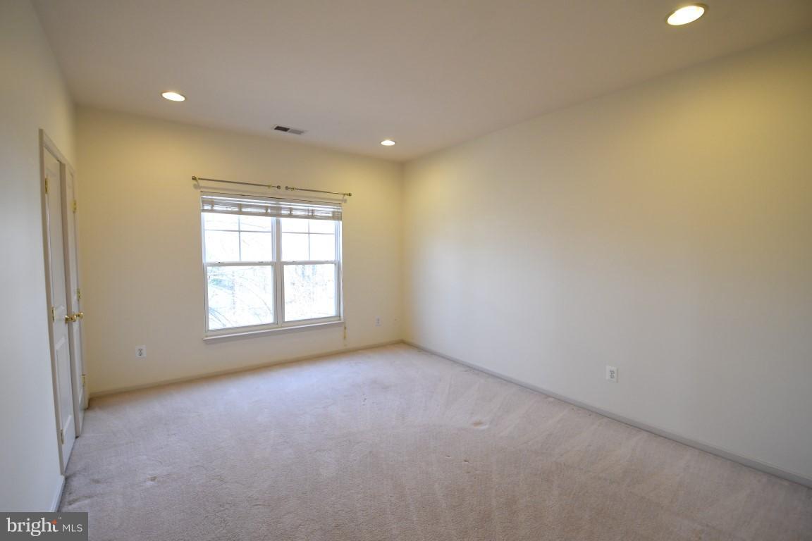 12845 Victory Lakes Loop Bristow, VA 20136 - Photo 17 of 27 an empty room with a window