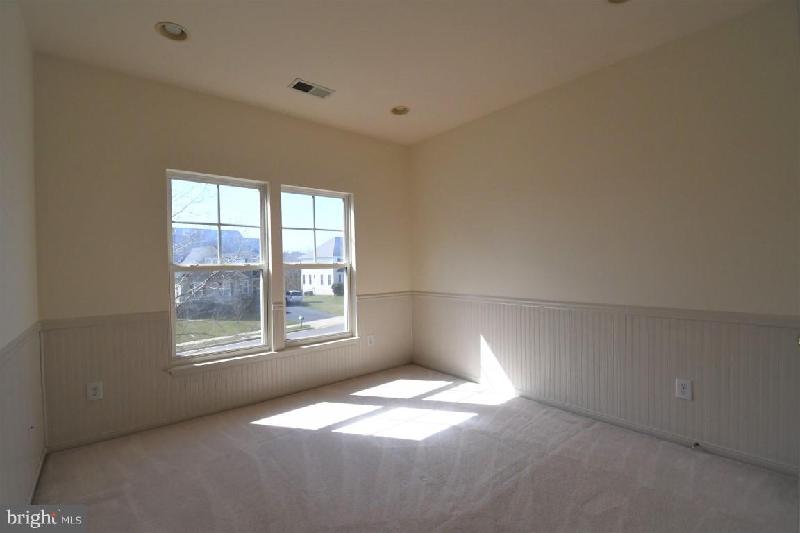 12845 Victory Lakes Loop Bristow, VA 20136 - Photo 18 of 27 a view of an empty room with a window