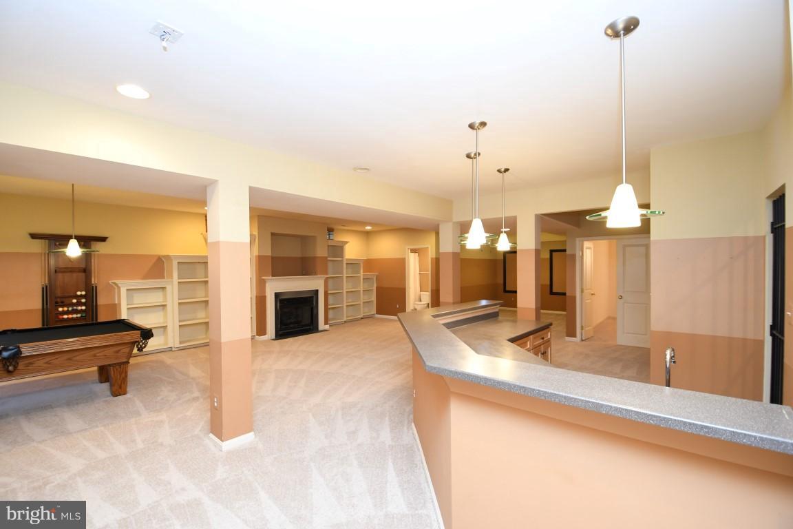 12845 Victory Lakes Loop Bristow, VA 20136 - Photo 19 of 27 a view of a living room and kitchen