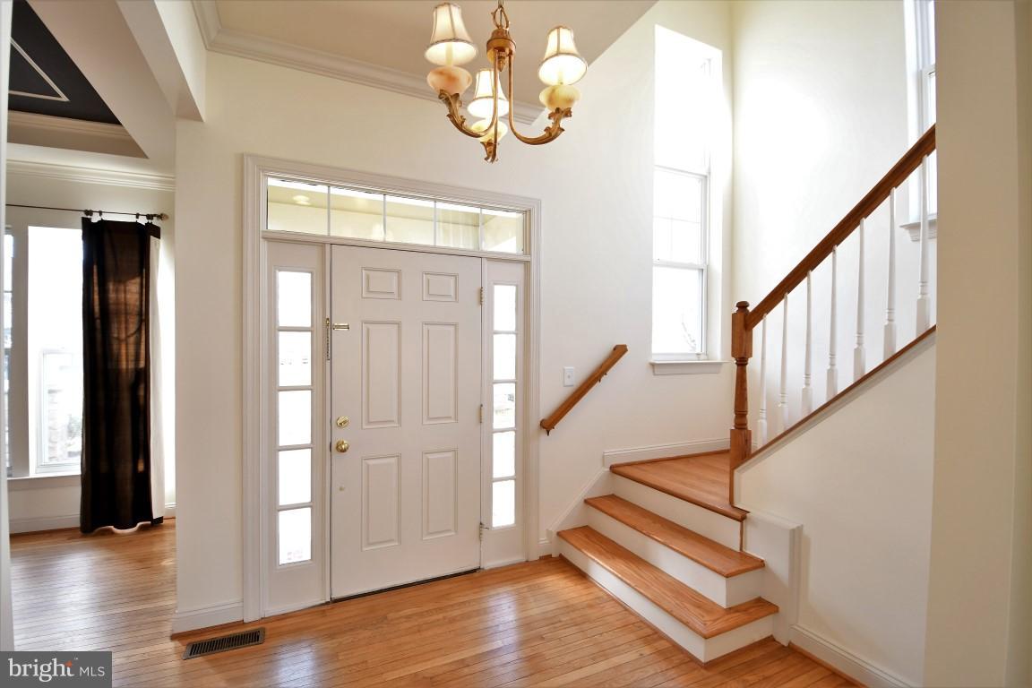 12845 Victory Lakes Loop Bristow, VA 20136 - Photo 3 of 27 a view of entryway with wooden floor
