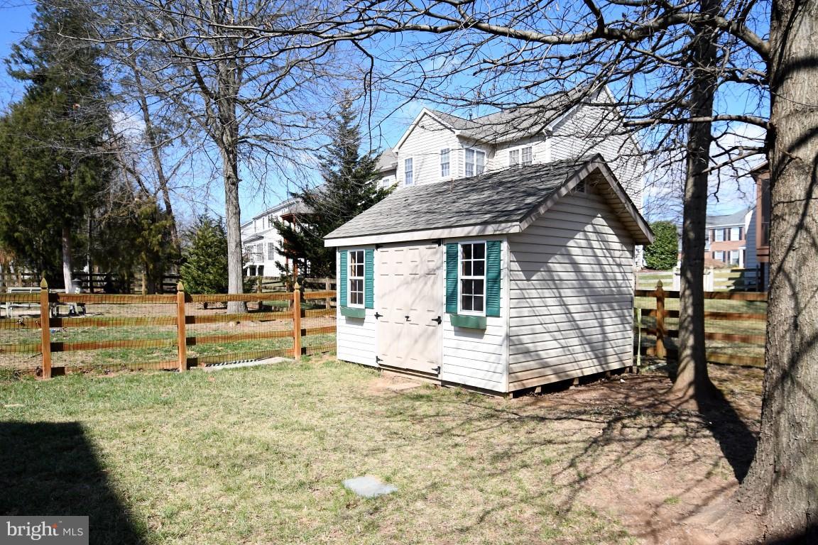 12845 Victory Lakes Loop Bristow, VA 20136 - Photo 24 of 27 a front view of a house with a yard