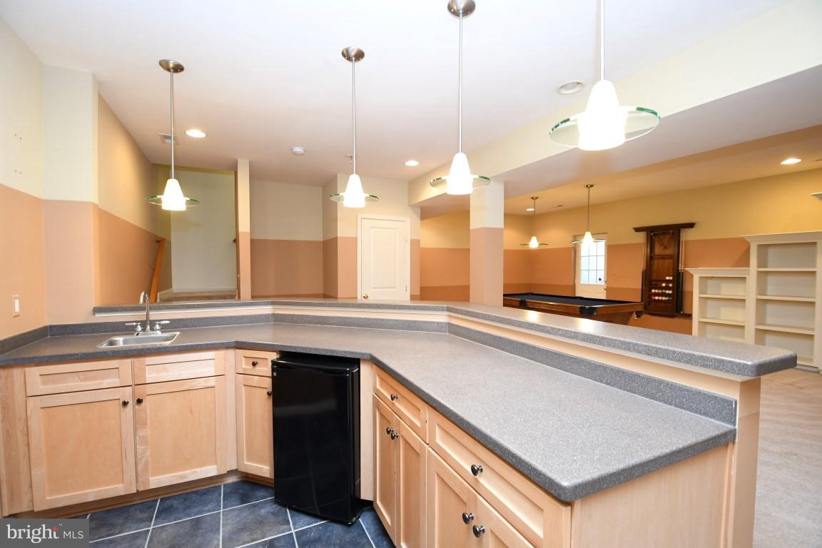 12845 Victory Lakes Loop Bristow, VA 20136 - Photo 26 of 27 a kitchen with a sink and cabinets