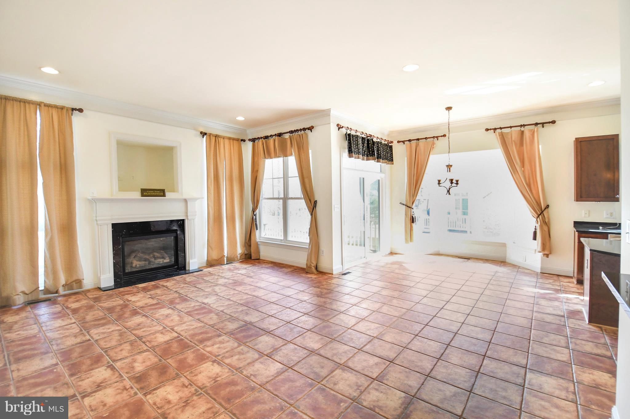12845 Victory Lakes Loop Bristow, VA 20136 - Photo 9 of 27 a view of a livingroom with a fireplace