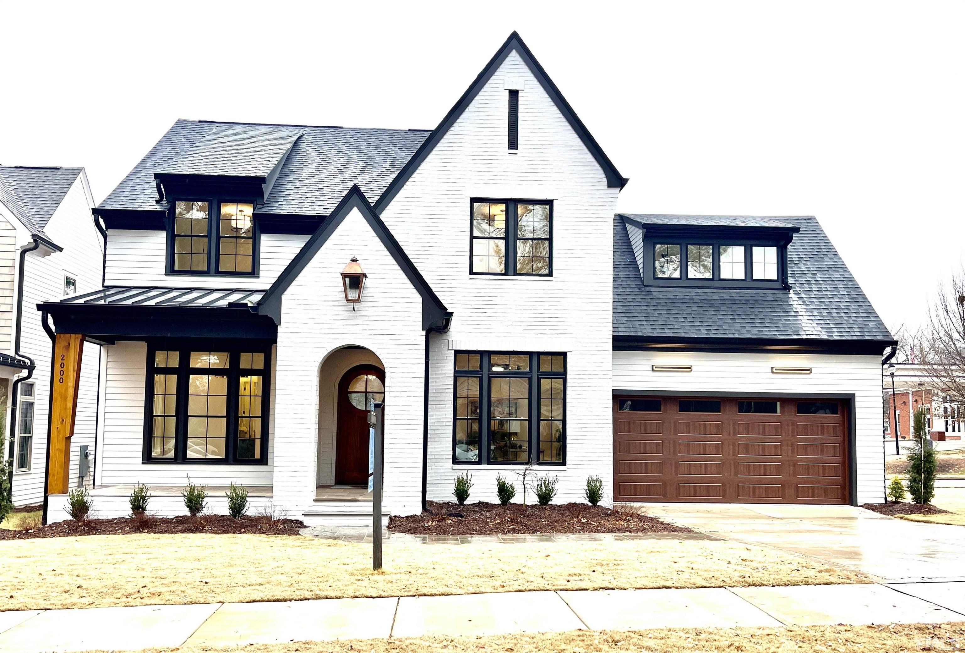2000 Pine Drive Raleigh, NC 27608 - Photo 1 of 39 a view of a brick house with many windows