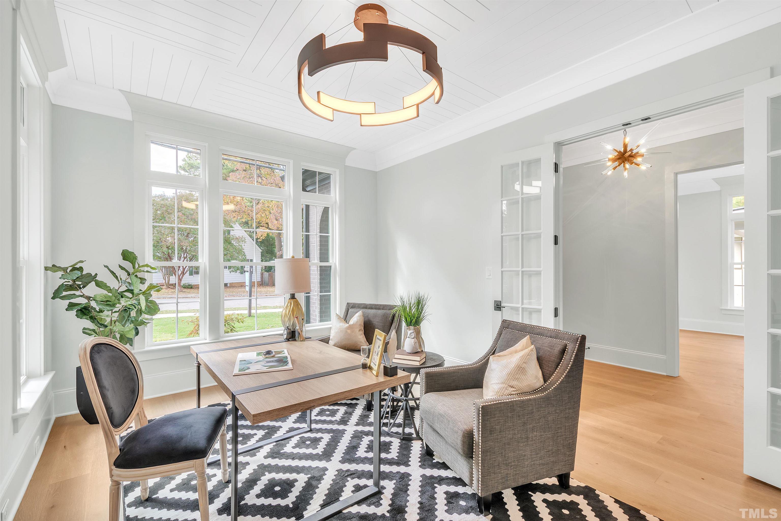 2000 Pine Drive Raleigh, NC 27608 - Photo 12 of 39 a living room with furniture and a large window
