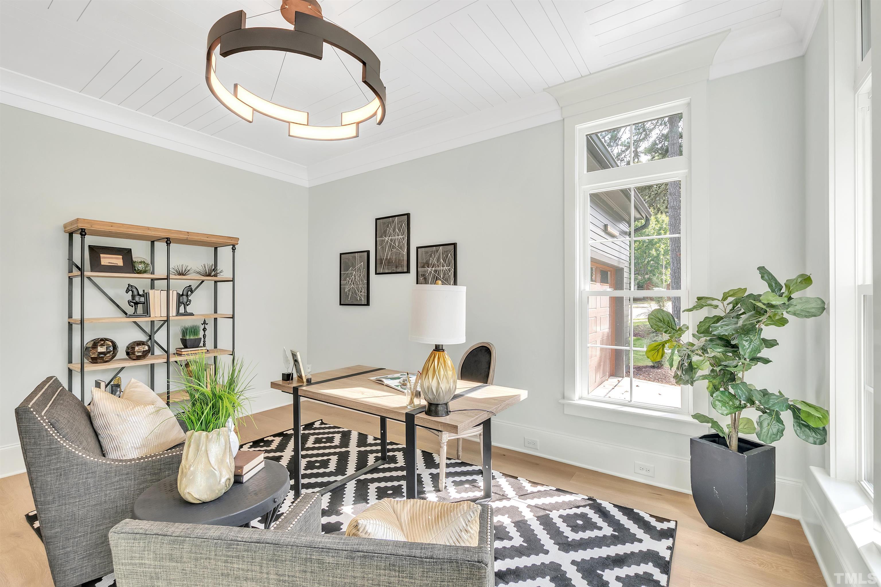 2000 Pine Drive Raleigh, NC 27608 - Photo 13 of 39 a living room with furniture potted plant and window
