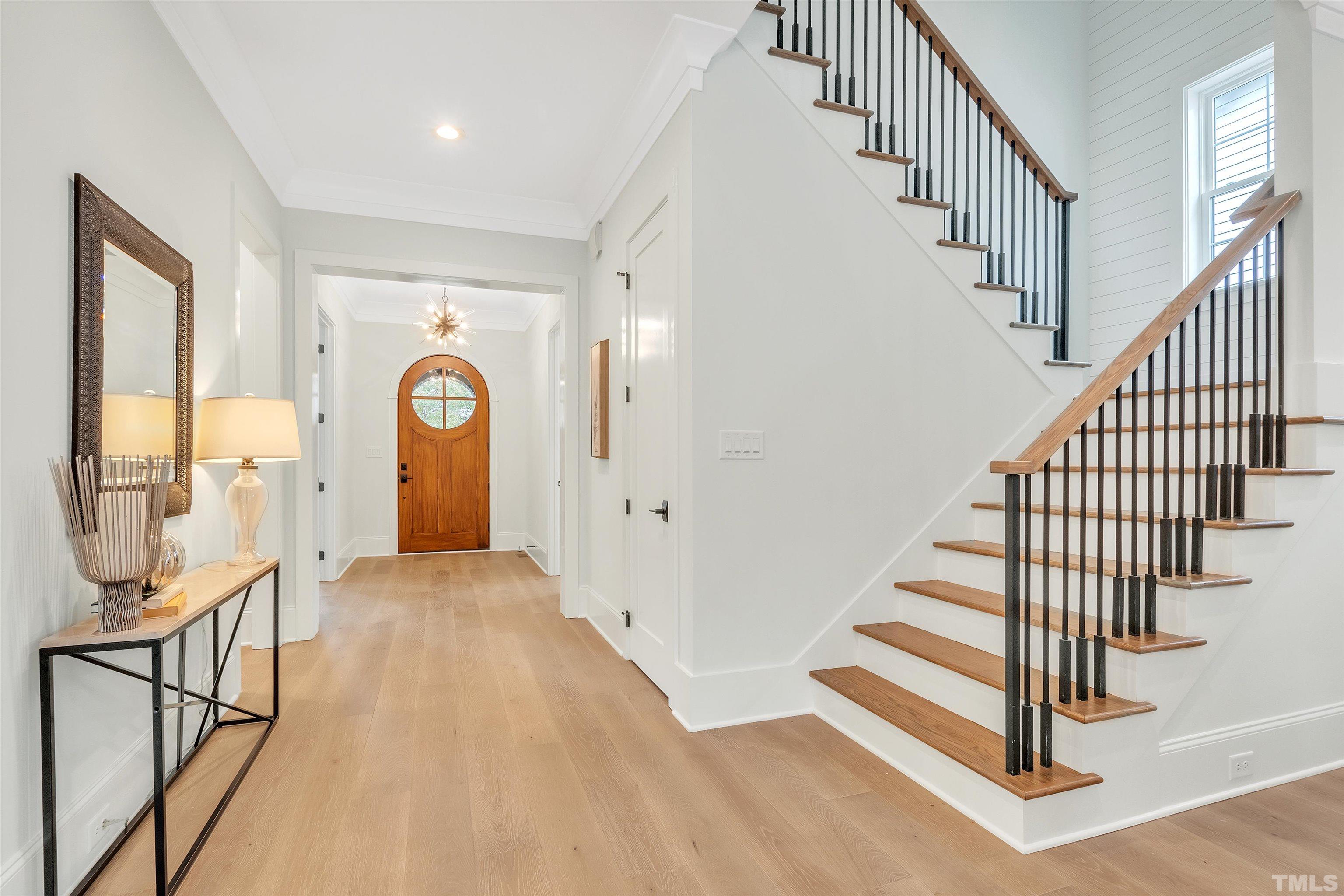2000 Pine Drive Raleigh, NC 27608 - Photo 14 of 39 a view of entryway and hall with wooden floor